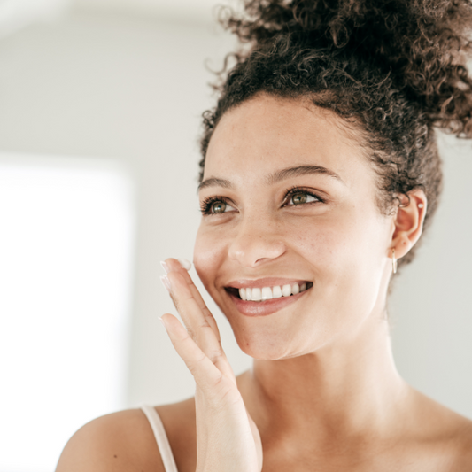Woman with glowing skin smiling
