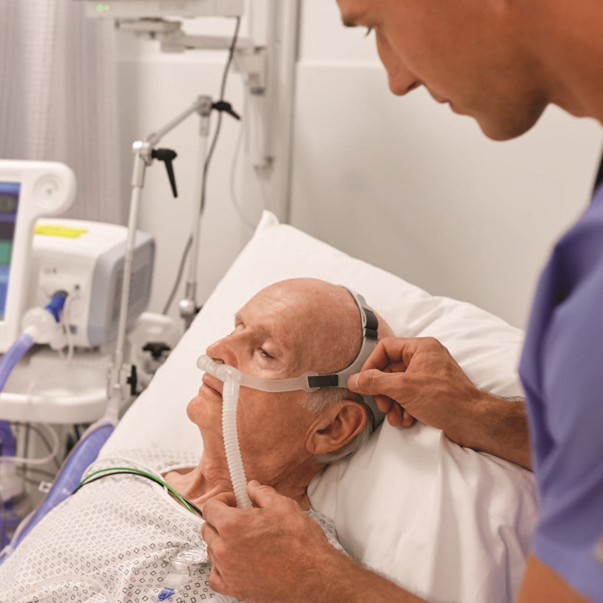 Nurse Applying Philips Respironics High Flow Nasal Cannula on Patient