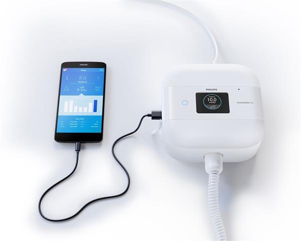 Stock Image of Philips Respironics DreamStation Go Auto Travel CPAP Machine W/ Cellphone for Sleep Report