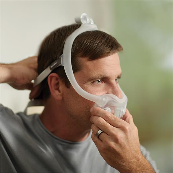 Image of Man Fitting His Philips Respironics DreamWear Full Face CPAP Mask W/ Headgear