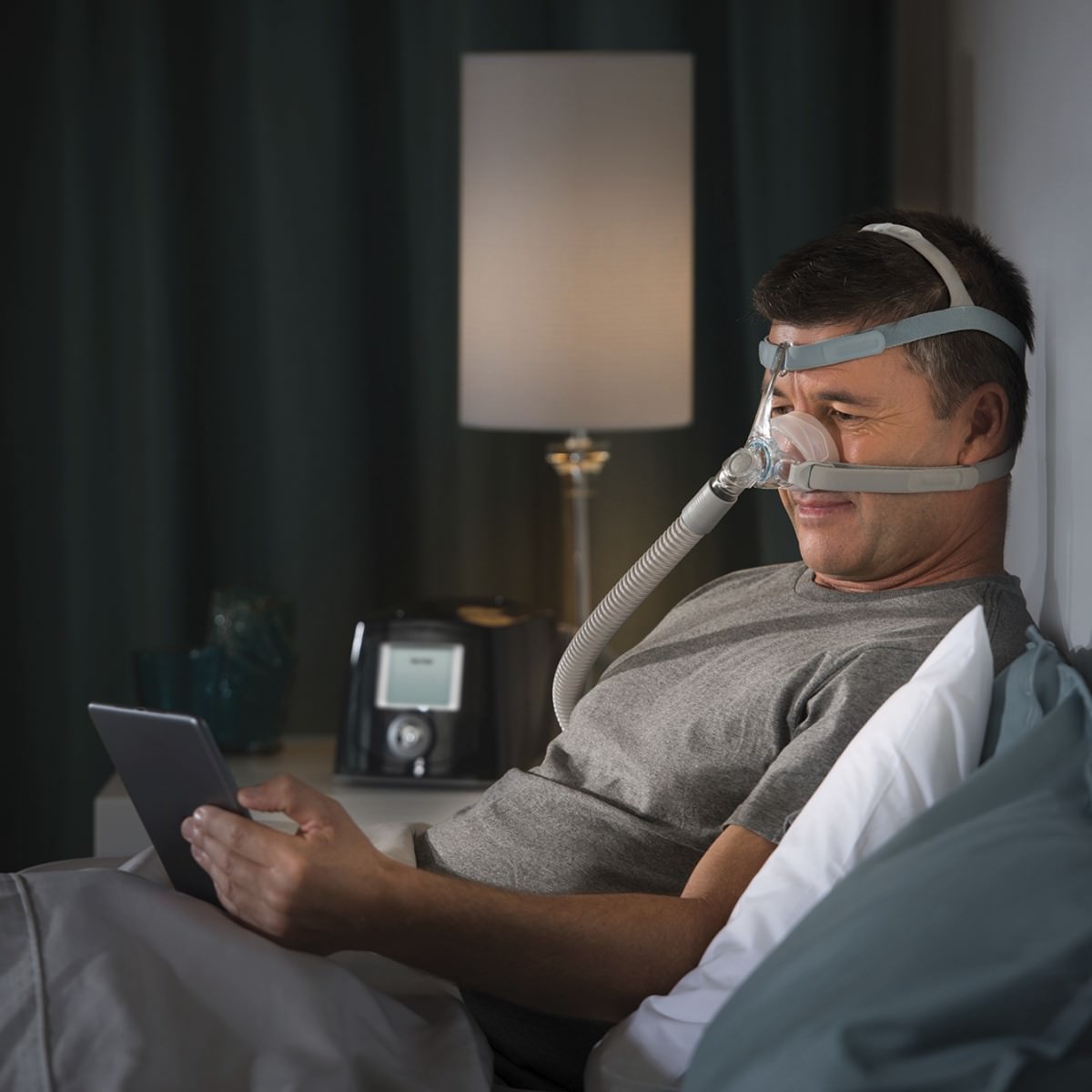 Photo of man wearing Fisher & Paykel Eson 2 nasal CPAP mask kit with headgear