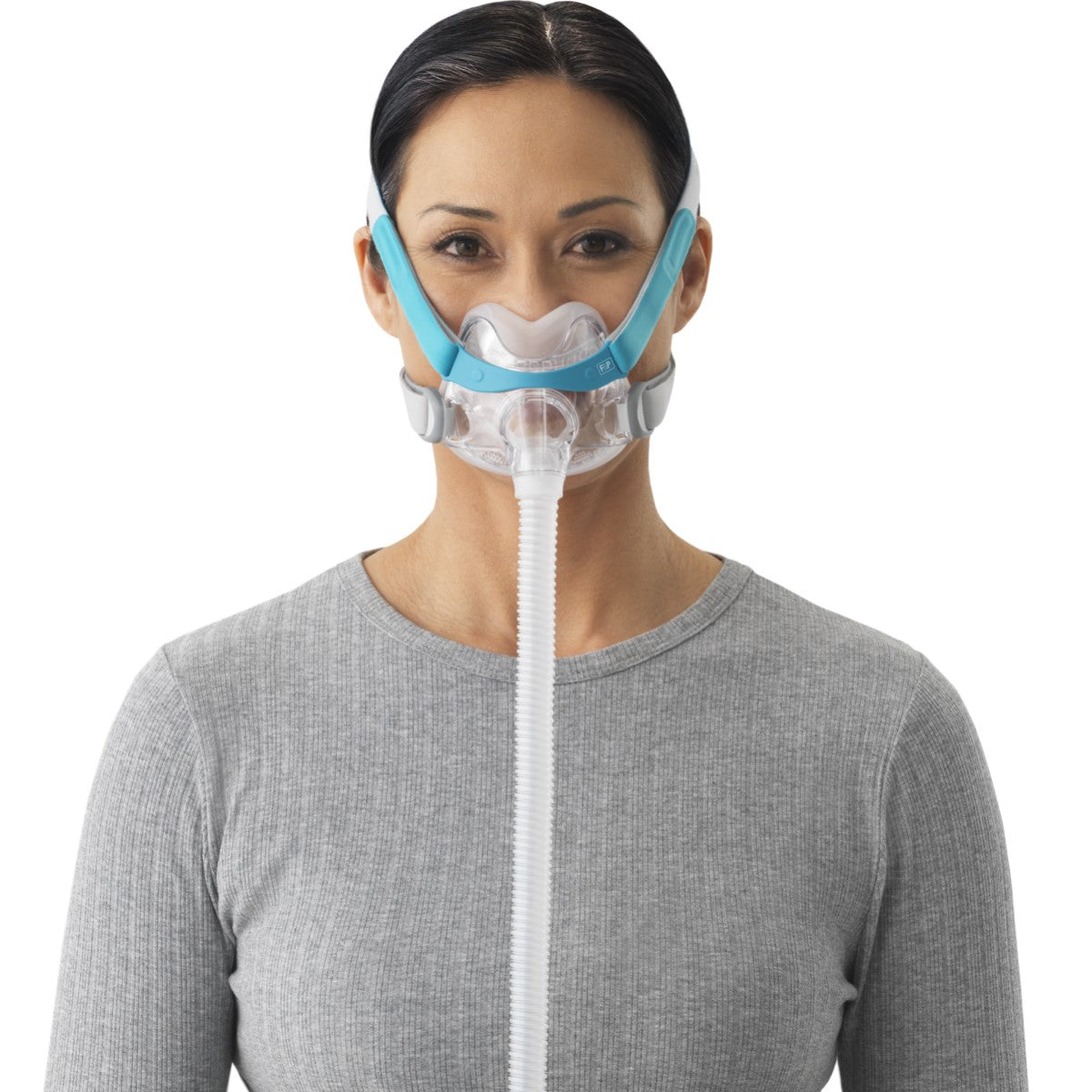 Stock photo of woman wearing Fisher & Paykel Evora full face CPAP mask kit with headgear