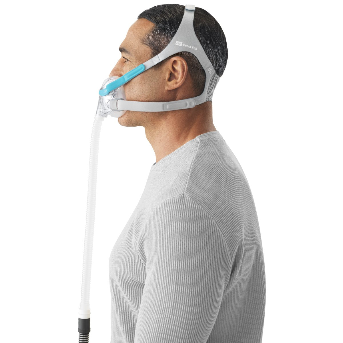 Stock photo of man wearing Fisher & Paykel Evora full face CPAP mask with headgear
