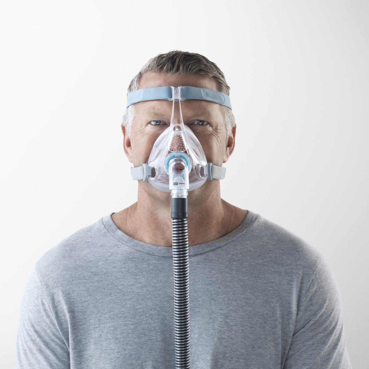 Stock Image of Man Wearing Fisher & Paykel Vitera Full Face CPAP Mask W/ Headgear