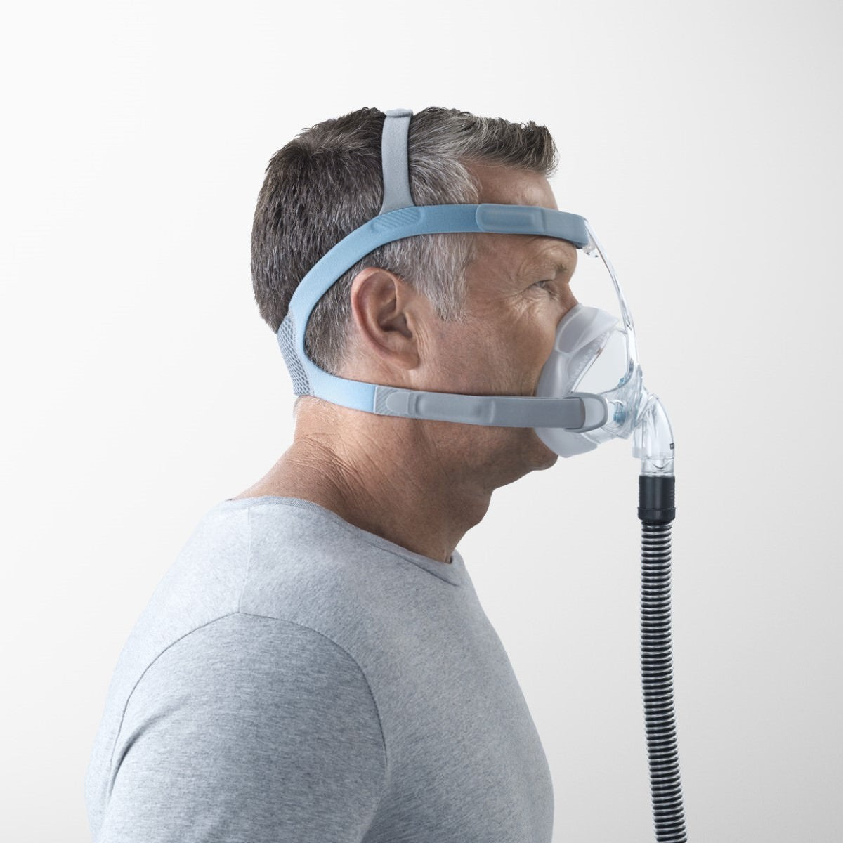 Side View of Man Wearing His Fisher & Paykel Vitera Full Face CPAP Mask W/ Headgear