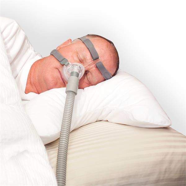 Photo of man sleeping with Drive DeVilbiss Medical IntelliPAP Sleep Aid CPAP Pillow