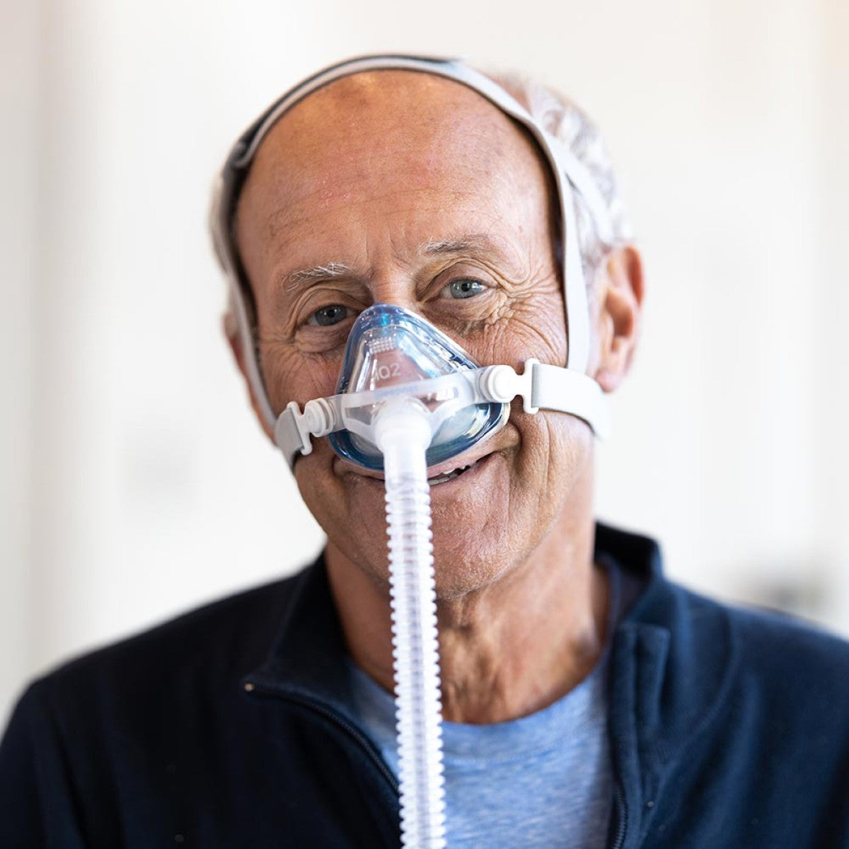 Image of Man Wearing iQ2 Nasal CPAP Mask W/ Headgear