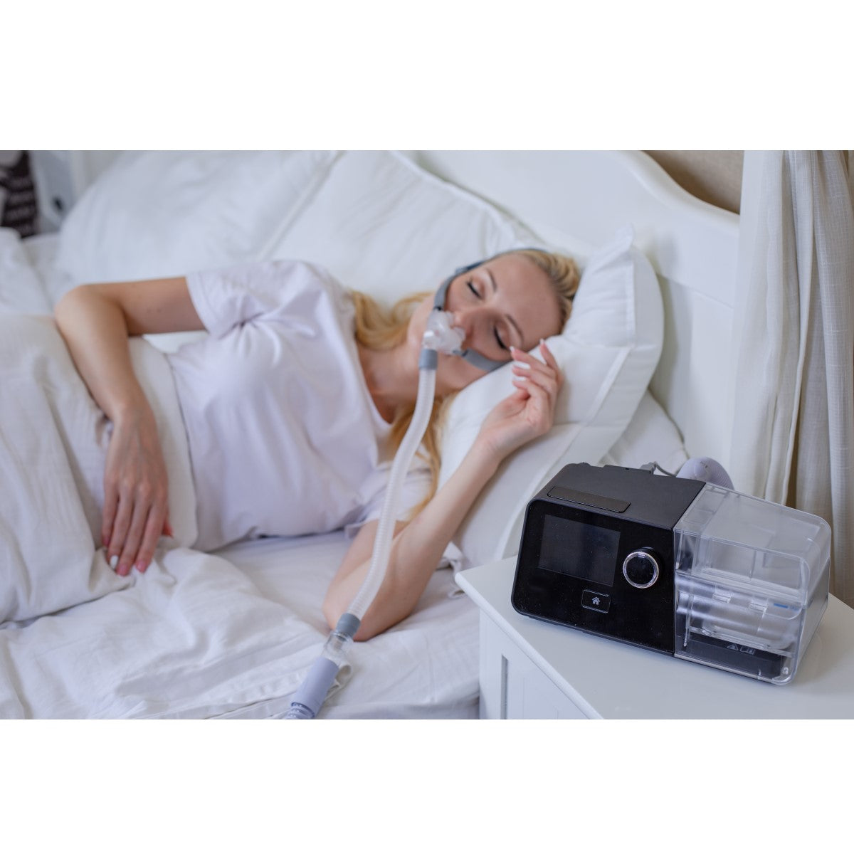 Person Laying Supine Using Their 3B Medical Luna G3 Auto CPAP Machine