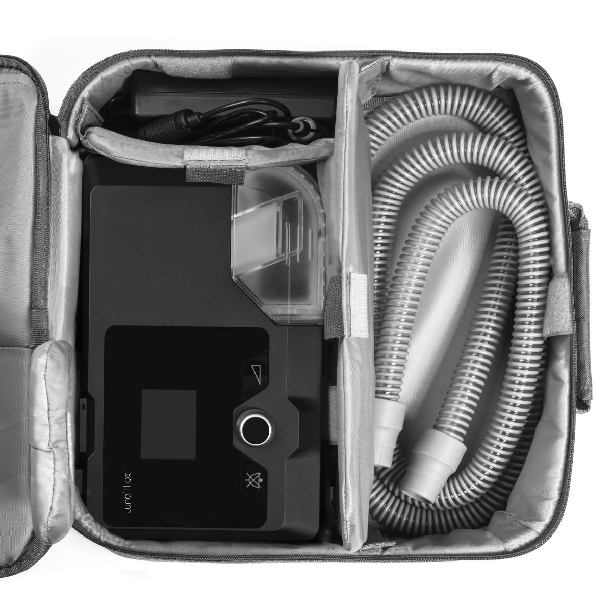Stock photo of React Health Luna II QX Auto CPAP machine, machine bag, tubing, and power block and cord