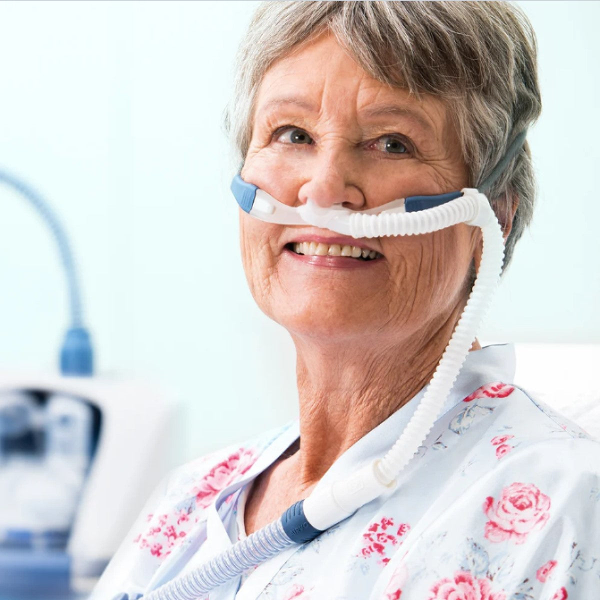 Photo of woman wearing Fisher & Paykel Optiflow Plus nasal cannula size medium