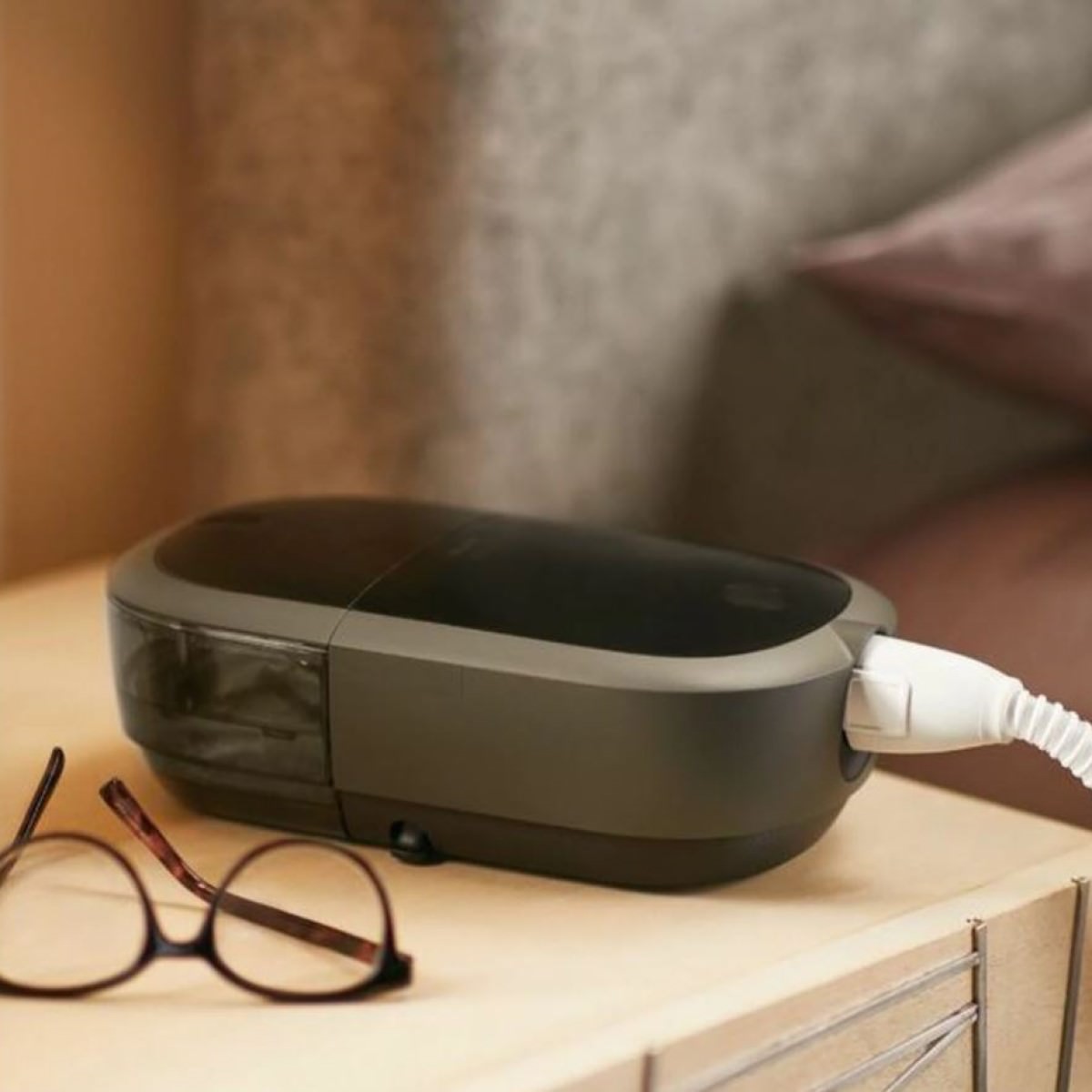 Photo of Philips Respironics DreamStation 2 Auto CPAP machine on nightstand