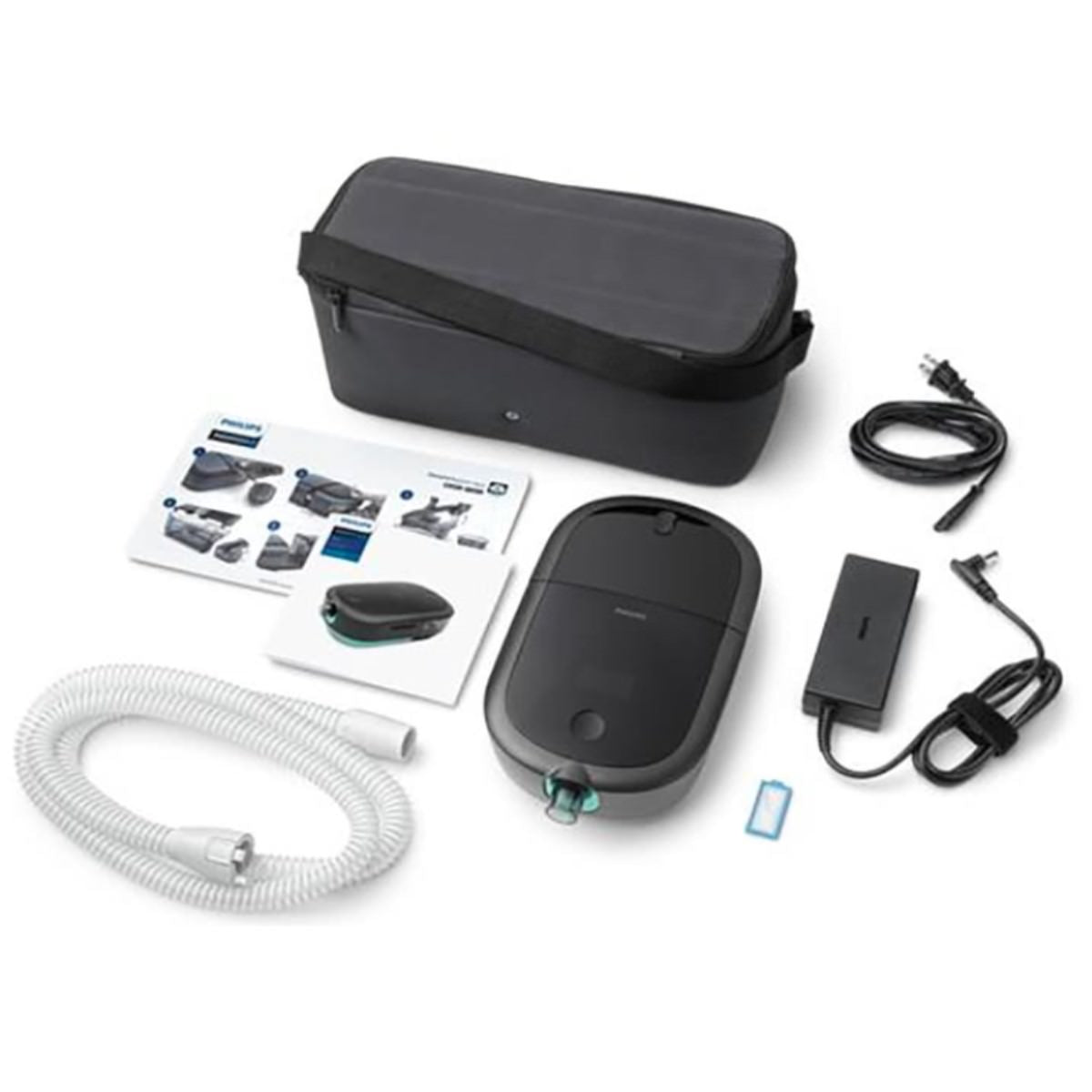 Stock photo of Philips Respironics DreamStation 2 Auto CPAP machine, SD card, power block and cord, tubing, and filter