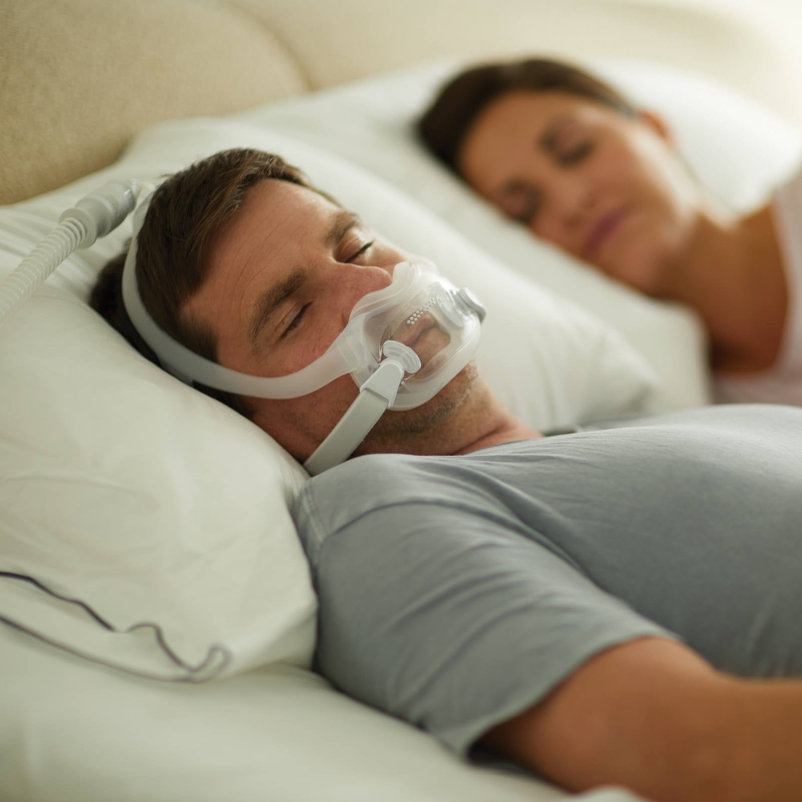 Man Sleeping Supine Wearing Philips Respironics DreamWear Full Face Mask W/ Headgear