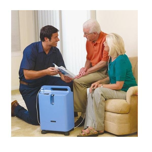 Photo of woman using Philips Respironics EverFlo Q Oxygen Concentrator