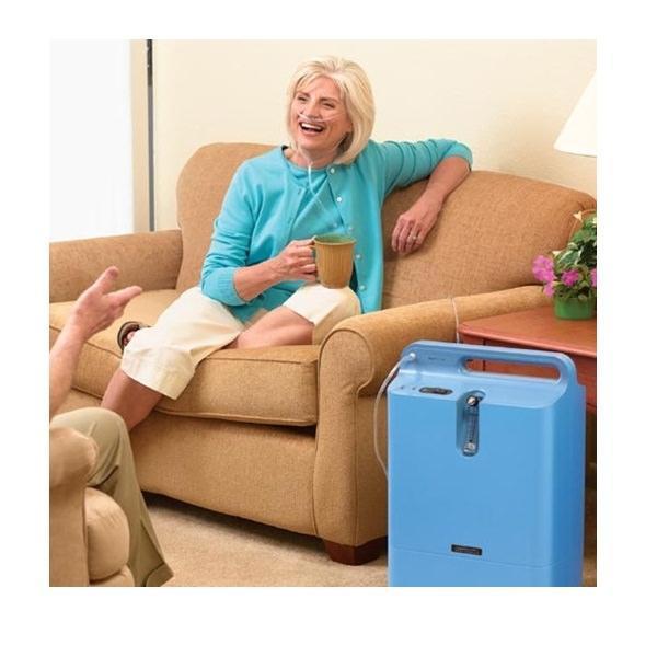 Photo of woman using Philips Respironics EverFlo Q Oxygen Concentrator