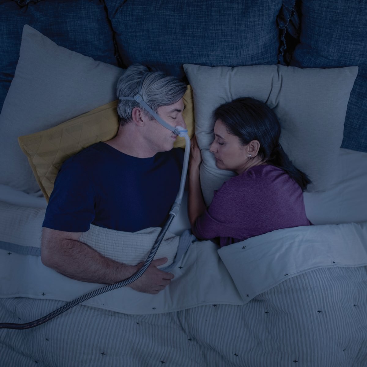 Photo of man sleeping while wearing ResMed AirFit N30 CPAP mask headgear strap