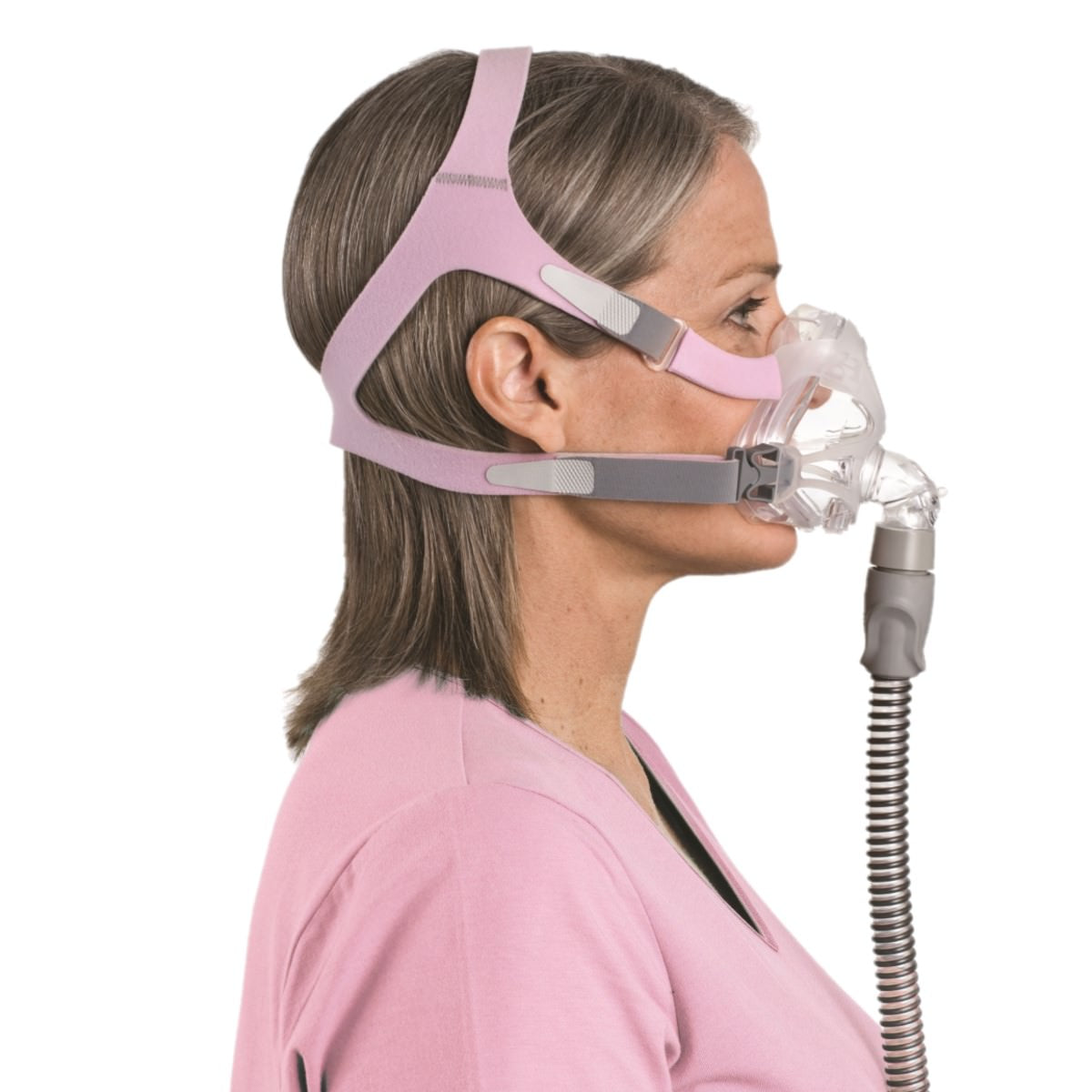 Stock photo of woman wearing ResMed Quattro FX for her full face CPAP mask with headgear