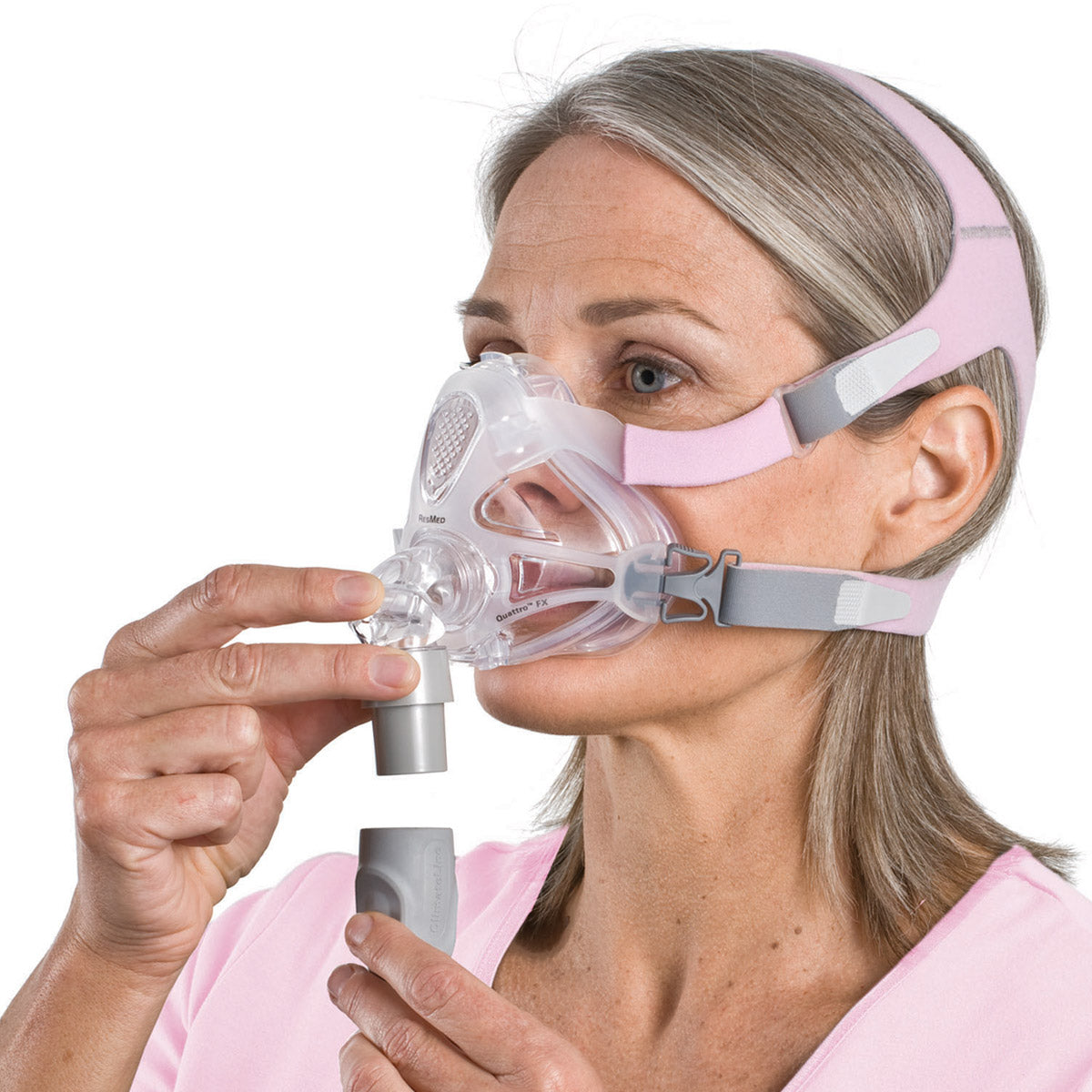 Stock photo of woman wearing ResMed Quattro FX for her full face CPAP mask with headgear