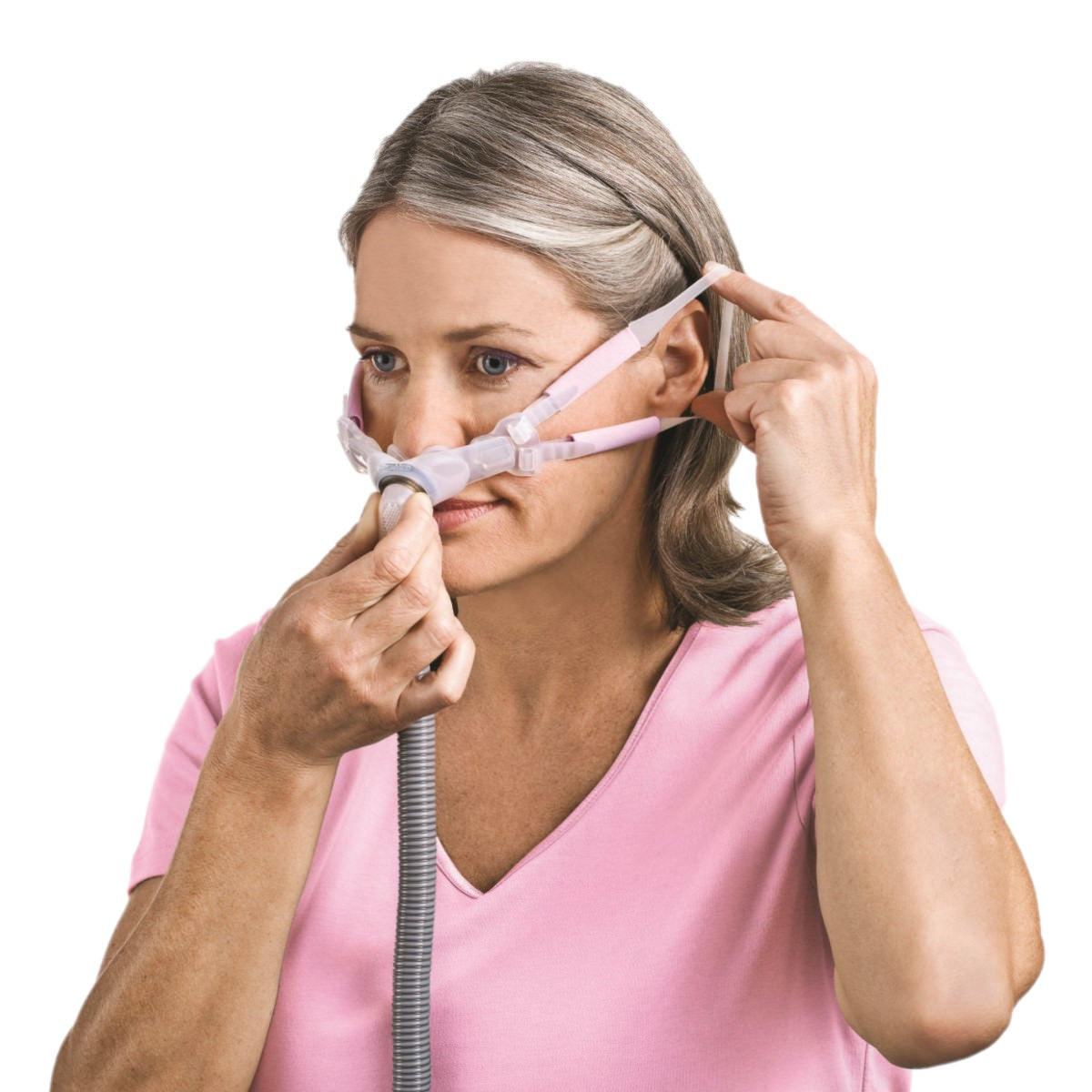 Stock photo of woman wearing ResMed Swift FX Bella Loops for her nasal pillow CPAP mask with headgear