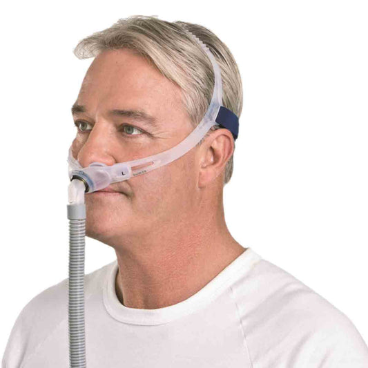 Side View of Man Wearing ResMed Swift FX Mask W/ Headgear and Short Tubing
