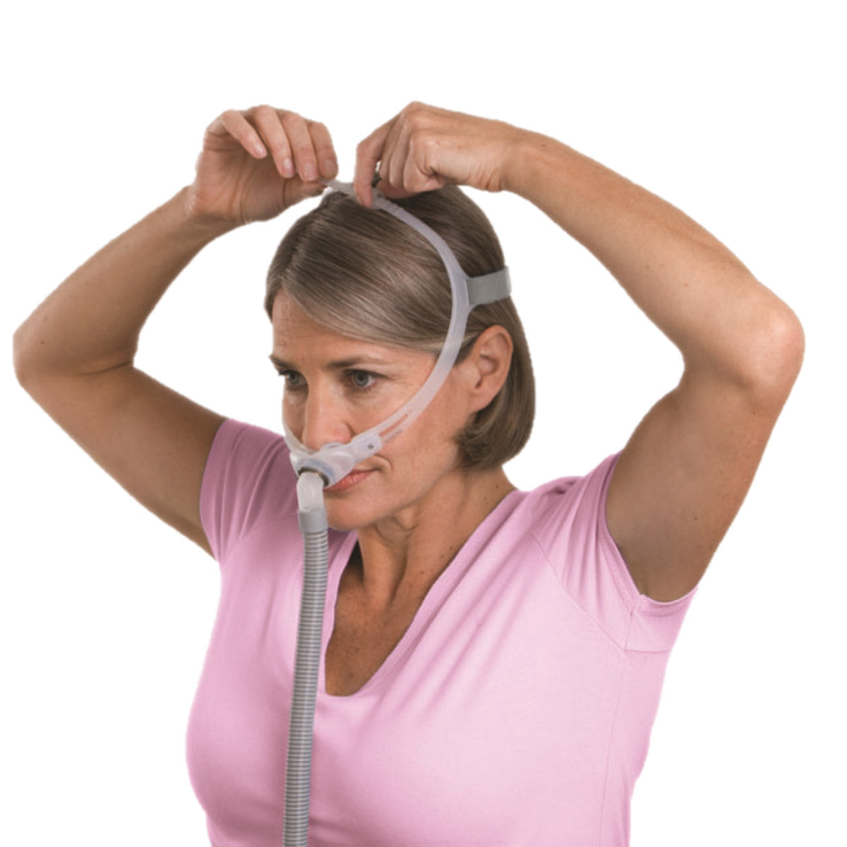 Stock photo of woman wearing ResMed Swift FX Bella for her nasal pillow CPAP mask with headgear