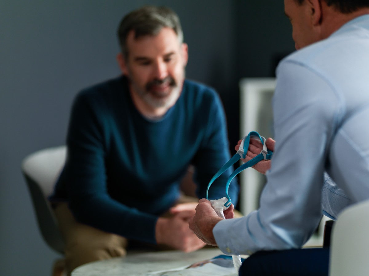 Man Sat Consulting W/ Physician about His CPAP Mask
