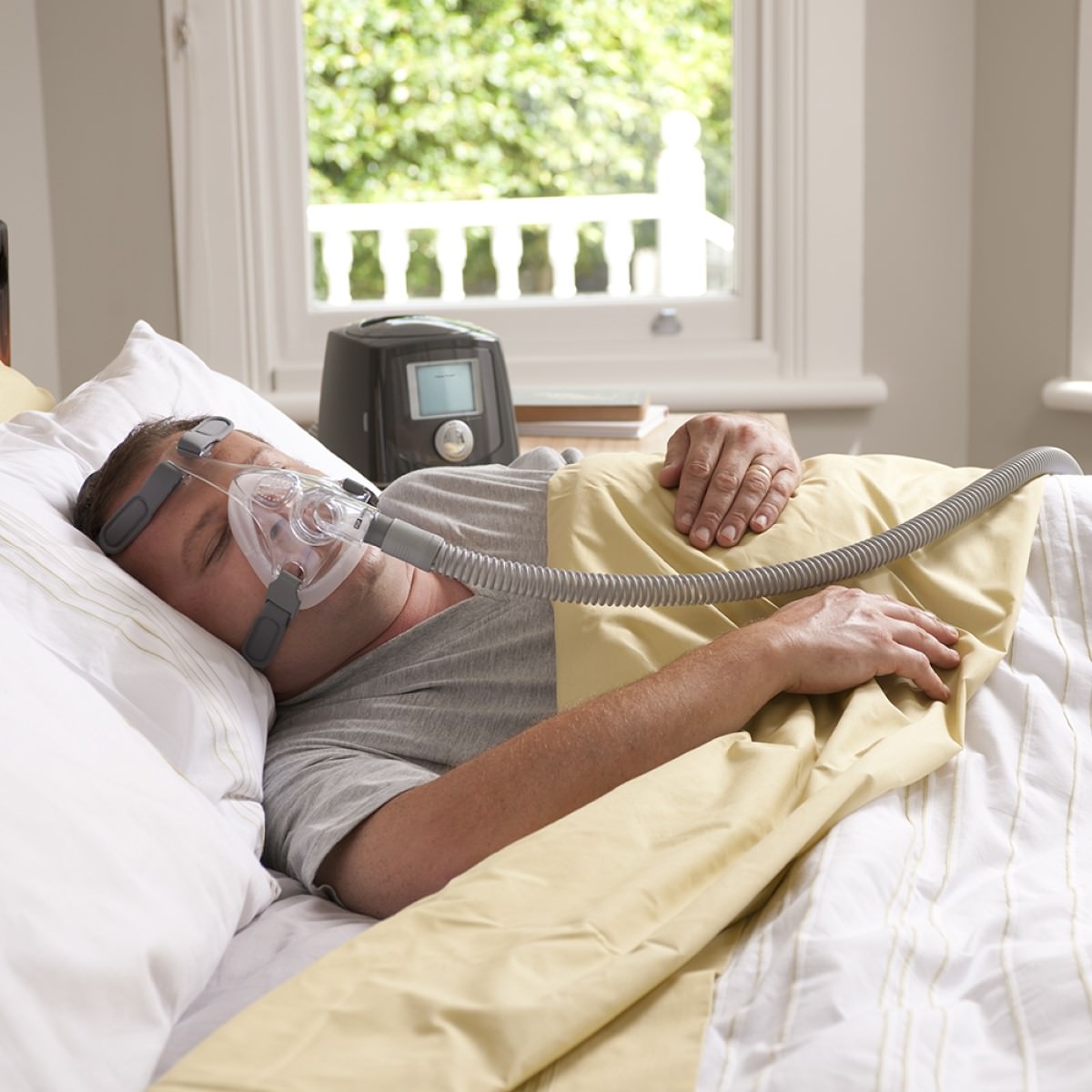 Man Sleeping Using Fisher & Paykel's Simplus Full Face CPAP Mask W/ Headgear