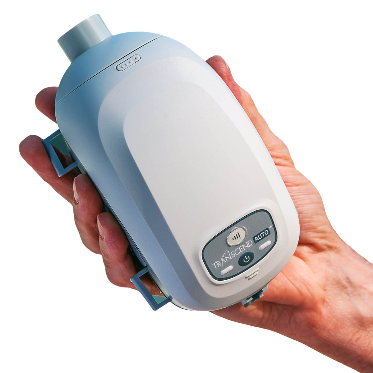 Stock photo of hand holding Somnetics Transcend Mini Auto CPAP With EZEX CPAP machine