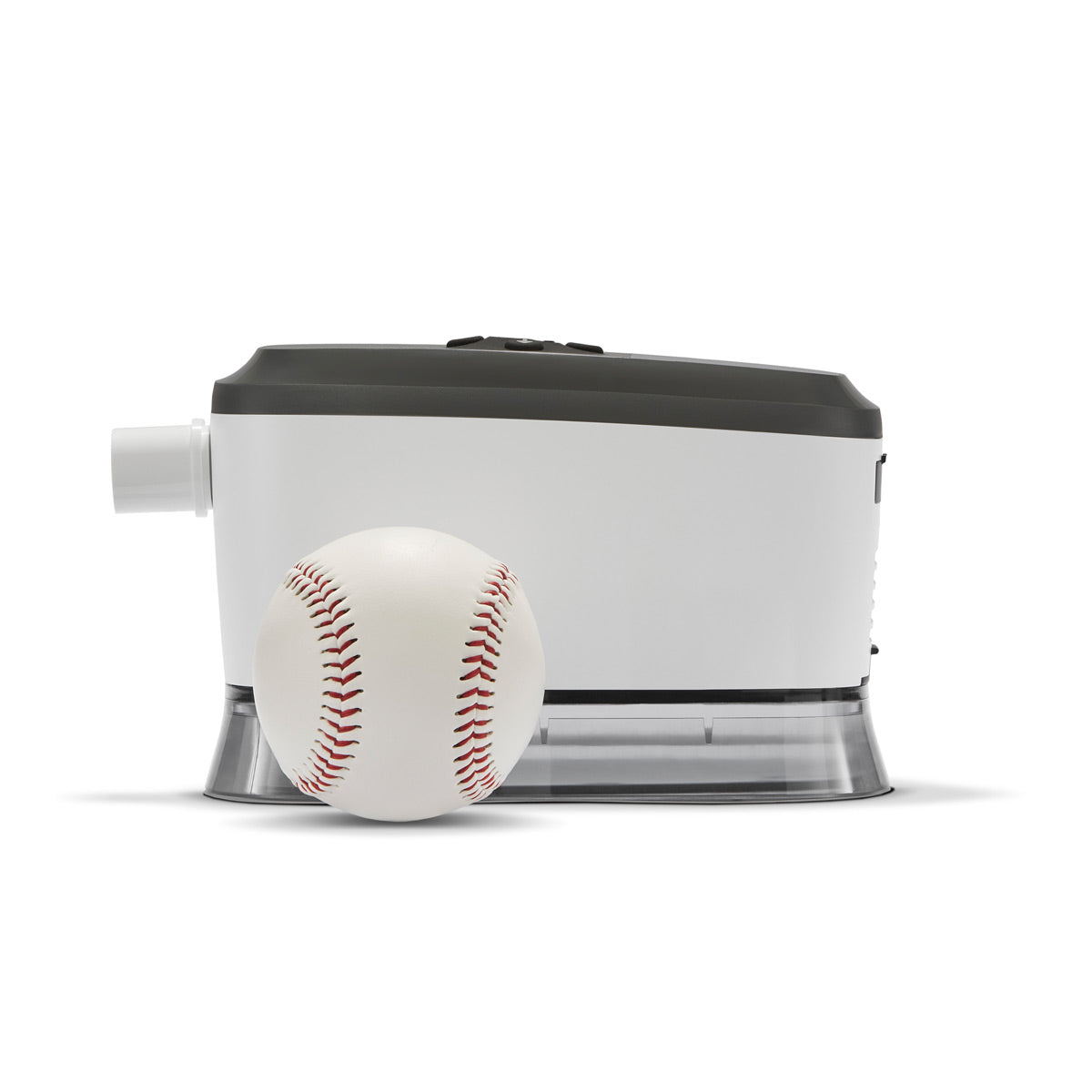 Stock image of Somnetics Transcend 365 Auto Travel MiniCPAP machine with a baseball in front of it