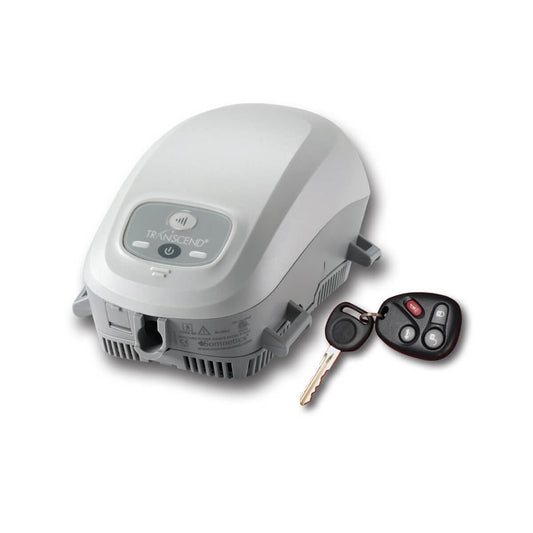Stock photo of Somnetics Transcend Auto Mini CPAP machine next to car keys