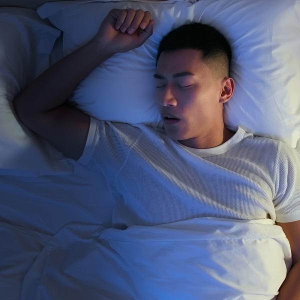 Man sleeping and snoring without a CPAP mask