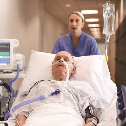 Nurse Taking Patient Wearing Philips Respironics AC611 High Flow Nasal Cannula 
