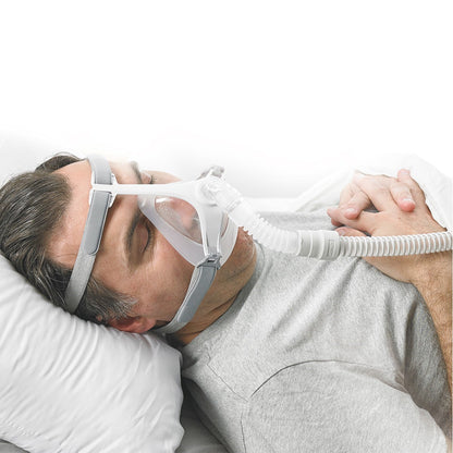 Stock photo of man using Apex Medical Wizard 320 full face CPAP mask with headgear