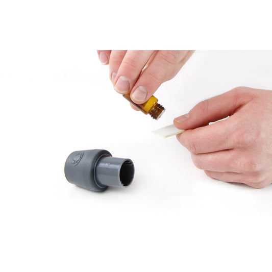 Stock photo of Person Using Aromatherapy Connector Kit for CPAP Machine Aroma Infusion