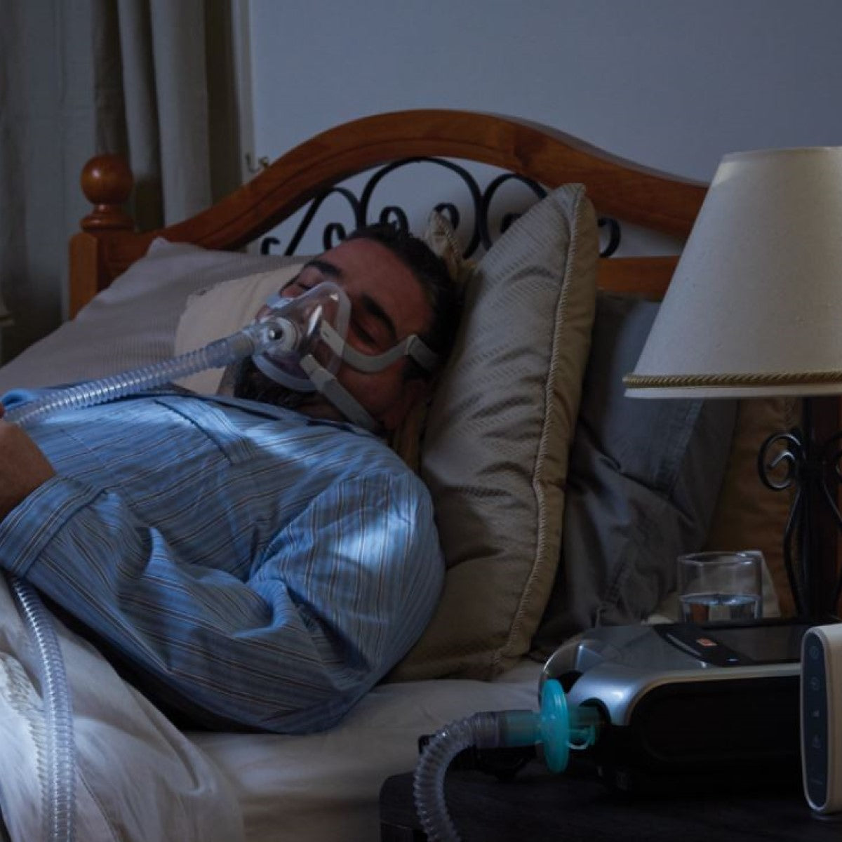 Photo of man using ResMed Certified Refurbished Astral 150 Portable Ventilator 