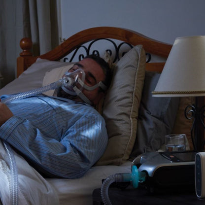Photo of man using ResMed Certified Refurbished Astral 150 Portable Ventilator 