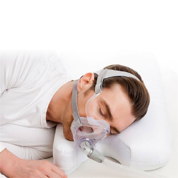 Stock photo of man using Choice One Medical Best in Rest Memory Foam CPAP Pillow 