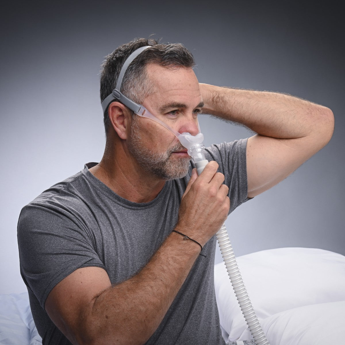 Image of Man Fitting His REMSleep DeltaWave CPAP Mask System