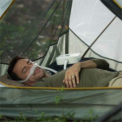 Man Sleeping in Tent Using His Philips Respironics DreamStation Go Auto Travel CPAP Machine 