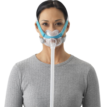 Stock photo of woman wearing Fisher & Paykel Evora full face CPAP mask kit with headgear