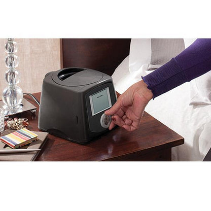 Photo of woman turning on Fisher & Paykel Icon Plus Premo CPAP machine