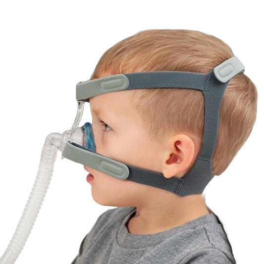 Stock photo of kid wearing SleepNet MiniMe 2 AirGel Pediatric nasal CPAP mask with headgear