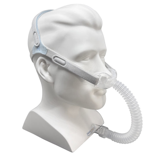 A sleep apnea mask with a clear corrugated tubing connector, displayed on a white mannequin head against a white background.