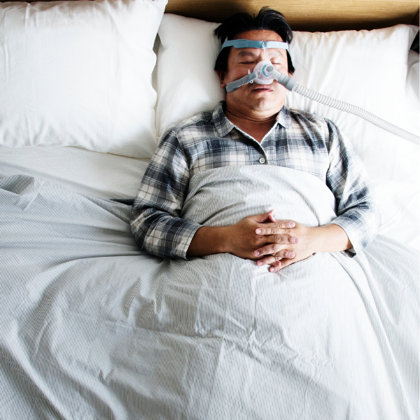 Man Laying Down Supine W/ a Nasal CPAP Mask