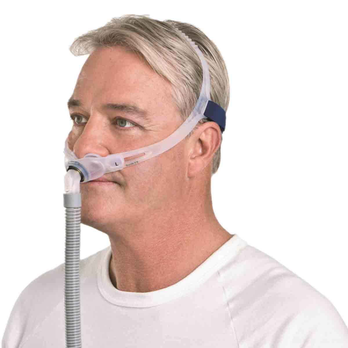 Side View of Man Wearing ResMed Swift FX Mask W/ Headgear and Short Tubing