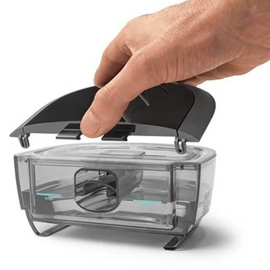 Man Placing the Lid on His Water Chamber for His DreamStation 2 by Philips Respironics 