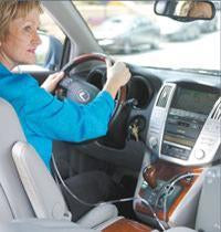 Woman Driving Her Car Using the Sequel Eclipse 3 Portable Oxygen Concentrator W/ autoSAT