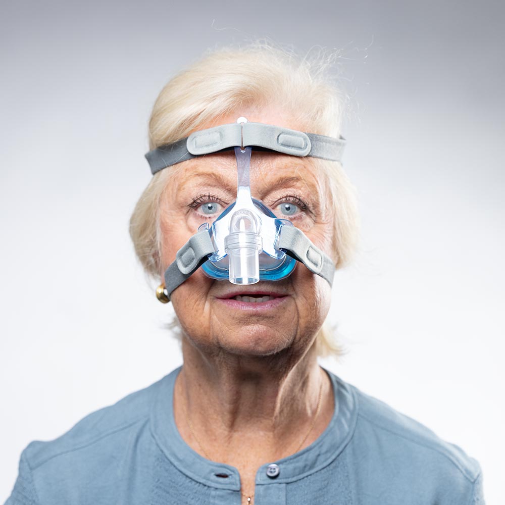 Photo of Woman Wearing SleepNet Aura Gel Nasal CPAP Mask with EZ Fit Headgear