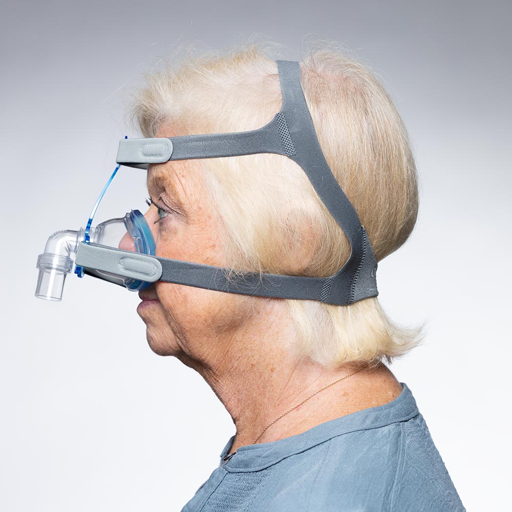 Photo of Woman Wearing SleepNet Aura Gel Nasal CPAP Mask with EZ Fit Headgear