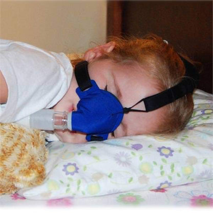 Child Sleeping on Her Side Using SleepWeaver Advance Pediatric Soft Cloth Nasal CPAP Mask W/ Headgear 
